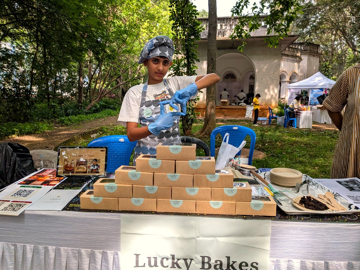 Lucky building his pyramid of Lucky Bakes boxes at Panchavati